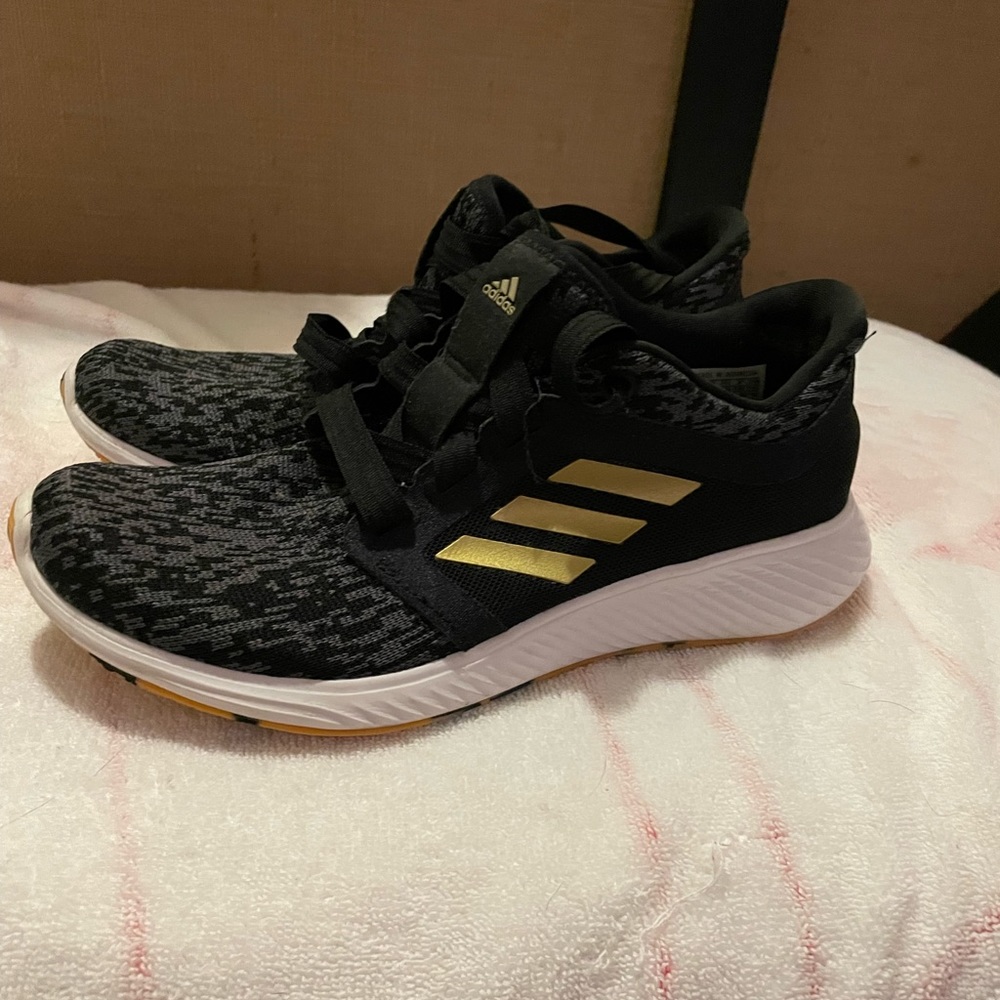 Adidas womens black and gold sneaker!